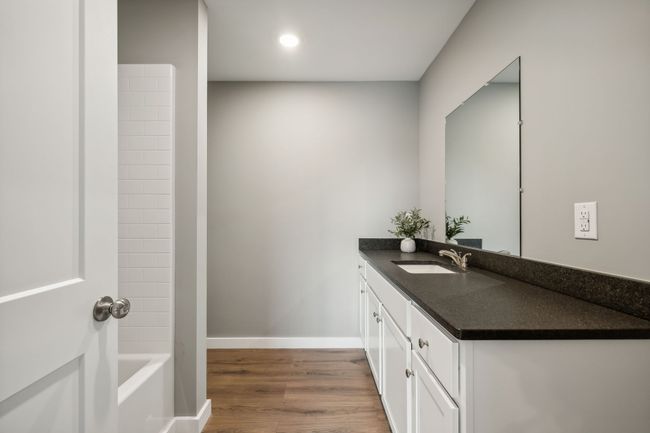 Primary bath with black leathered granite | Image 13