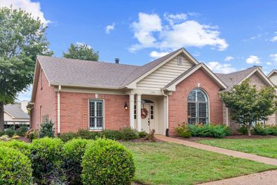 Brick with vinyl trim, maintained by the HOA | Image 1