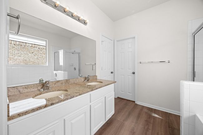 The master bath comes with a double vanity and new granite tops | Image 19