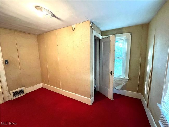 Spare room with visible vents, baseboards, and carpet floors | Image 19