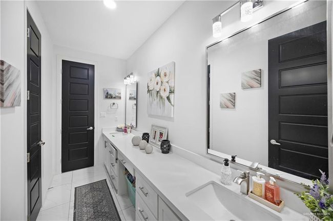 Full bathroom featuring double vanity and marble finish flooring | Image 13