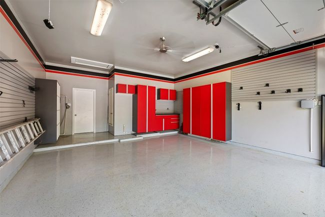 Epoxy coated floor with built in storage and a work area. | Image 37