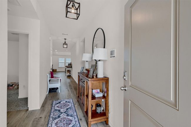 Foyer entrance featuring light wood-style floors and baseboards | Image 5