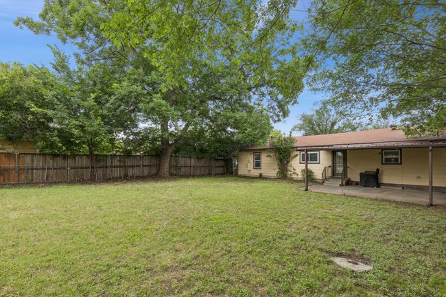 Oversized backyard with a covered patio area | Image 23