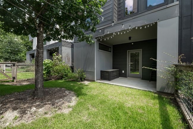 Doorway to property with a yard, fence, and a patio area | Image 26