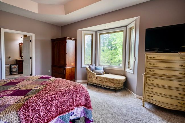 Bedroom with baseboards and light carpet | Image 20