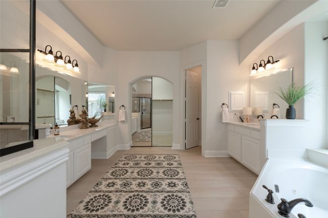 Full bath with a whirlpool tub and two vanities | Image 18