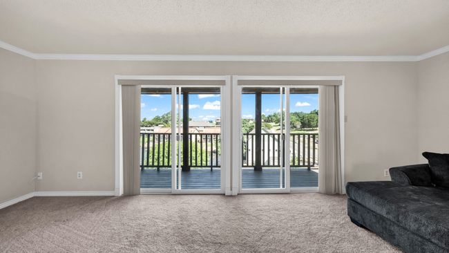 Living room with double sliders to balcony | Image 13