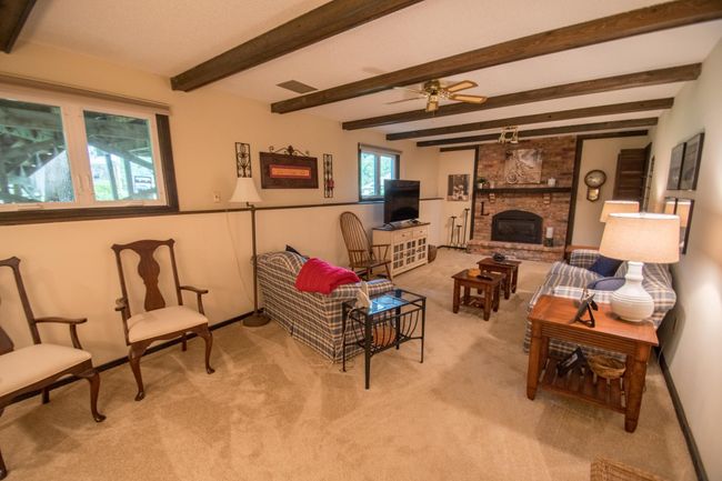 Lookout lower level family room with cozy gas fireplace | Image 12
