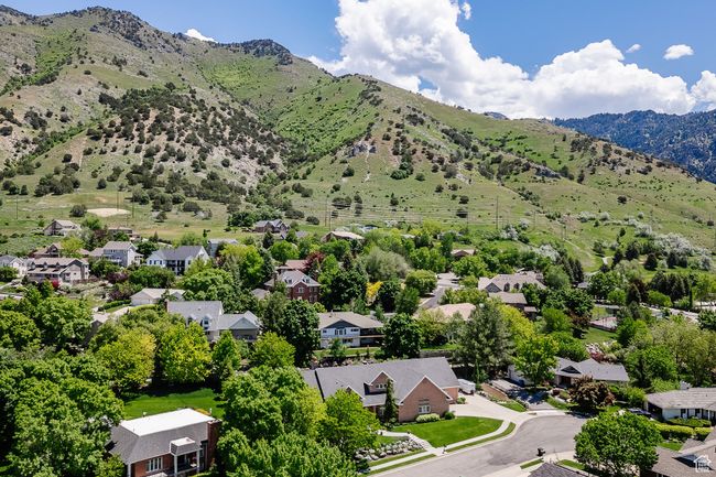 Aerial perspective of suburban area featuring a mountainous background | Image 103