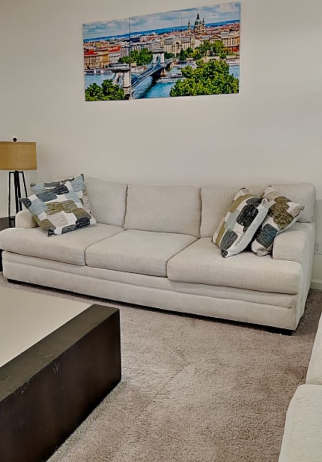 Living area featuring carpet floors and a water view | Image 19