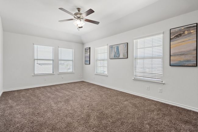 Spacious Game Room with carpet flooring, a ceiling fan, baseboards, natural light and ceiling | Image 31