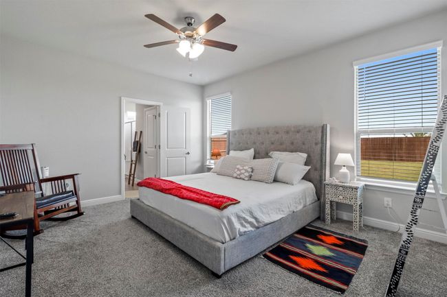 Bedroom with carpet floors and ceiling fan | Image 8