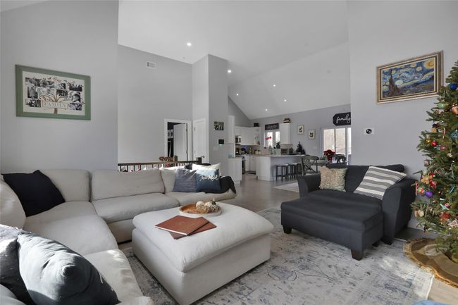 Living room with high vaulted ceiling | Image 4
