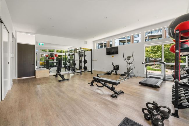 Gym featuring visible vents, a wealth of natural light, and wood finished floors | Image 29