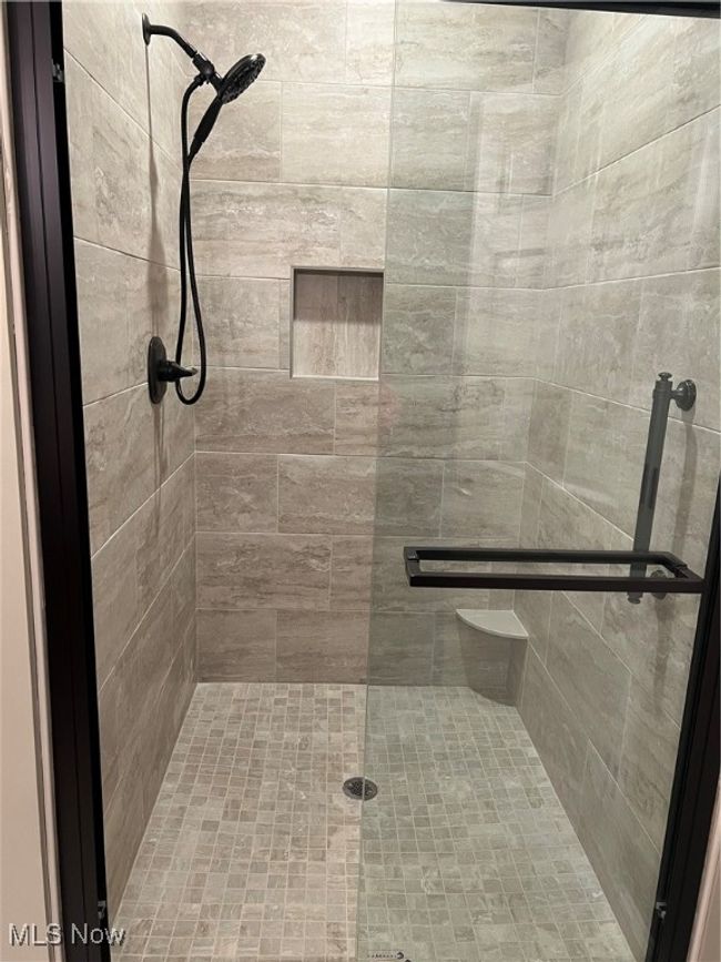 Bathroom with a shower stall | Image 8