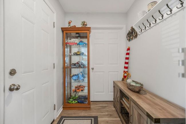 Mudroom with light wood-style floors | Image 26
