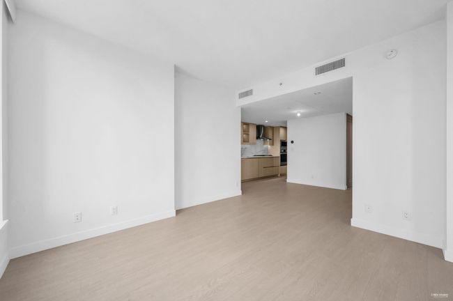 Unfurnished living room with light wood-style flooring | Image 11