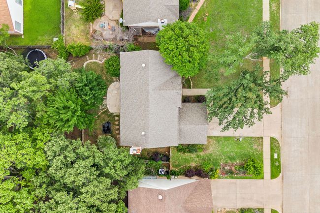 The property is located on a quiet street with neighboring homes spaced comfortably. | Image 38