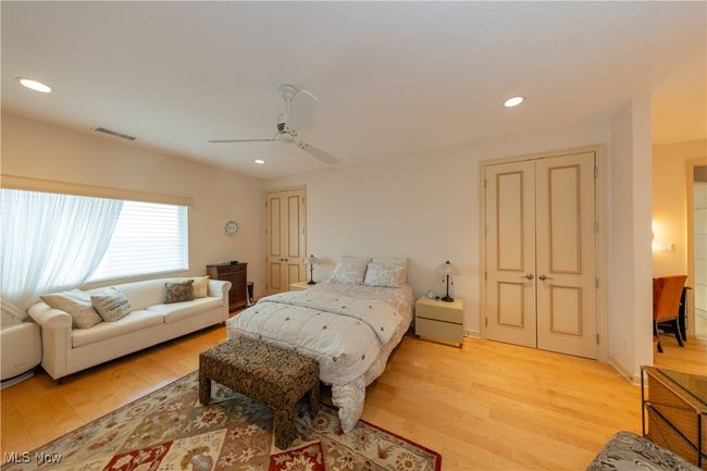 Primary Bedroom with recessed lighting, light wood finished floors, and a ceiling fan | Image 29