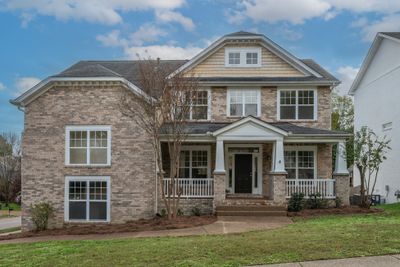 Wonderful home in the heart of McKay's Mill. With a Craftsman style and full front porch on a corner lot, this home offers a beautiful exterior to welcome you home! | Image 1