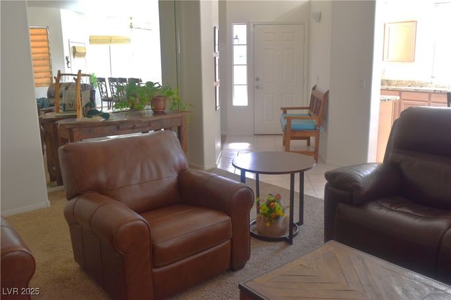 Living area with baseboards and light tile patterned floors | Image 20