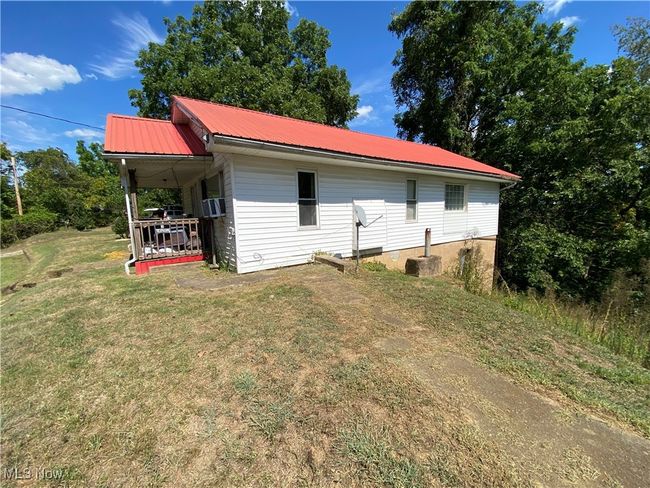 Back of house with a lawn | Image 4