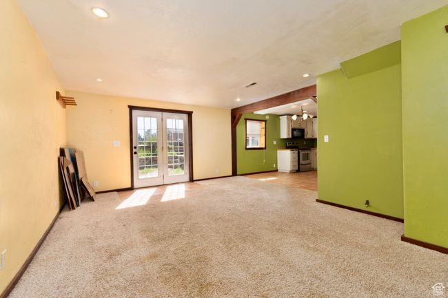 Unfurnished living room with carpet, baseboards, and recessed lighting | Image 27
