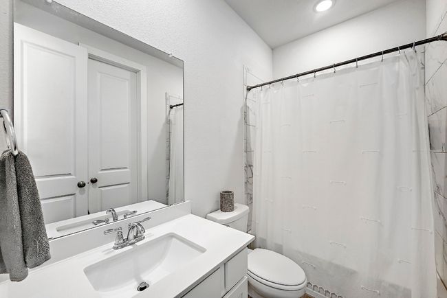 The guest bathroom is designed for comfort and convenience, with stylish finishes and easy access for visitors. | Image 19