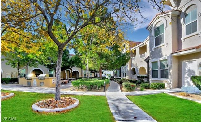 View of community with area for grilling, a residential view, and a yard | Image 4