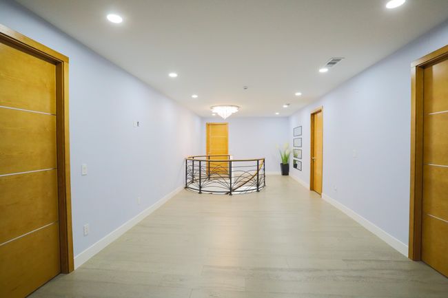 Hallway with light hardwood / wood-style floors | Image 16