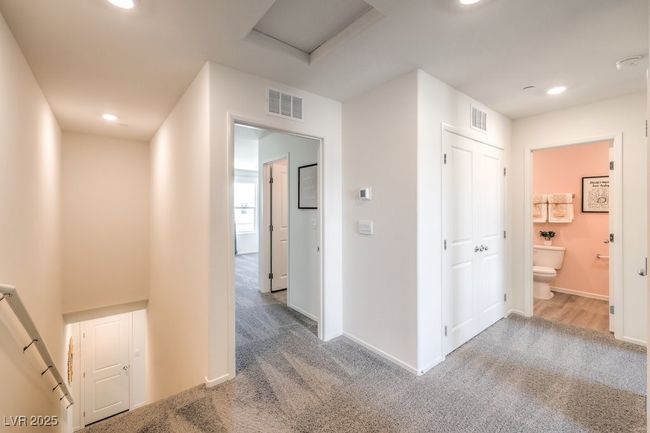 Corridor with visible vents, carpet, and recessed lighting | Image 21