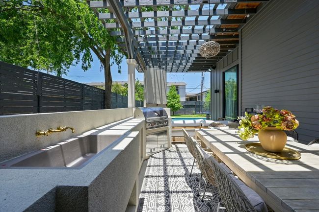 Newly installed built in grill and sink for outdoor entertaining. | Image 29