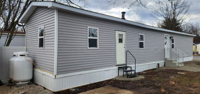 View of home's exterior with fence | Image 34