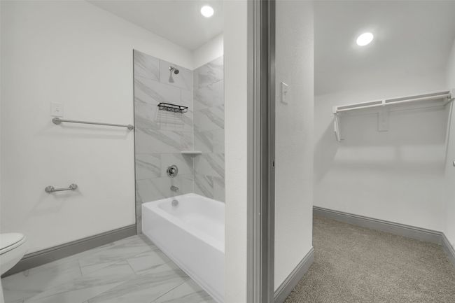 Full bath with toilet, baseboards, shower / bathtub combination, and recessed lighting | Image 29