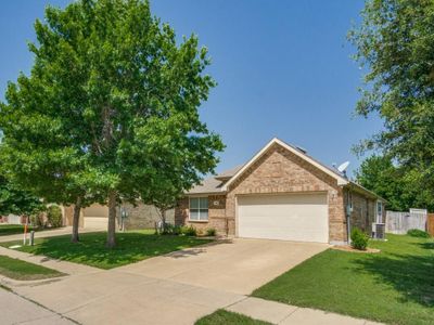 View of front of home featuring a garage and a front lawn | Image 2