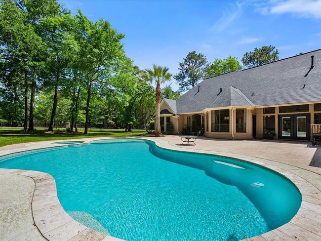 More views of the expansive pool area and lush surroundings remind you: this isn’t just a yard—it’s a lifestyle. | Image 44