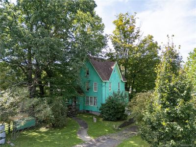 View of side of home featuring a lawn | Image 2