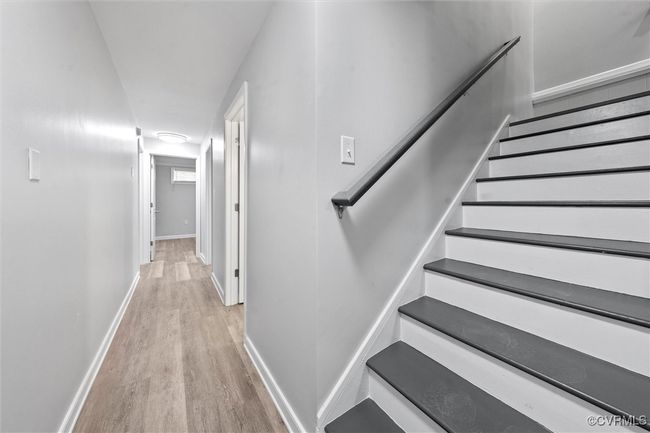 Stairway with wood finished floors and baseboards | Image 22