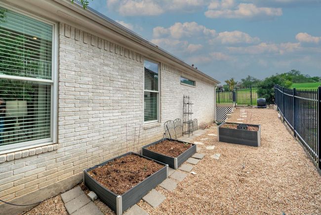 View of patio / terrace with a vegetable garden and fence private yard | Image 36