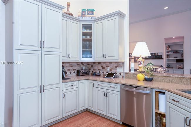 All cabinets have slide-out drawers including double trash and recycling bins. | Image 24