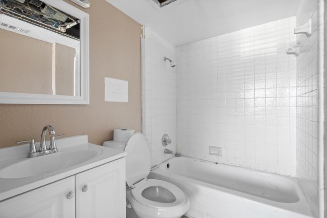 Bathroom featuring shower / washtub combination and vanity | Image 9
