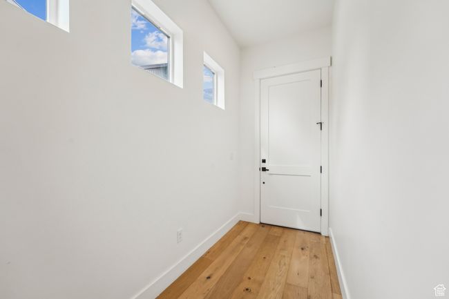 Entryway with baseboards and light wood-type flooring | Image 22