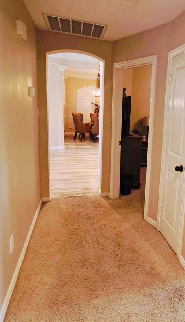 Corridor featuring arched walkways. | Image 15