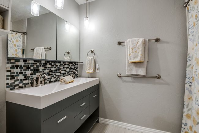 Bathroom featuring double sink vanity and backsplash | Image 20
