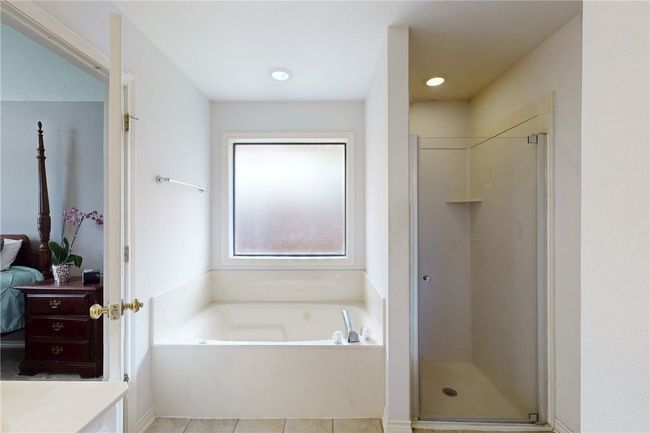 Full bathroom featuring a garden tub, a shower stall, ensuite bath, and vanity | Image 24