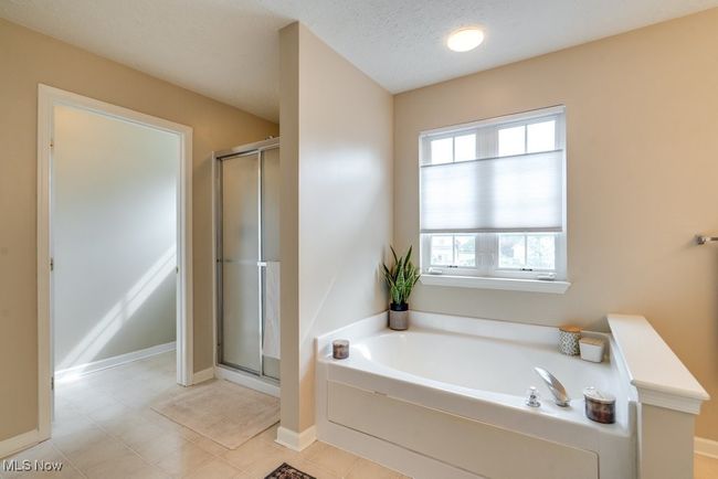 Bathroom with a garden tub and a stall shower | Image 25