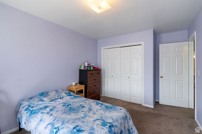 Carpeted bedroom featuring a closet and baseboards | Image 18