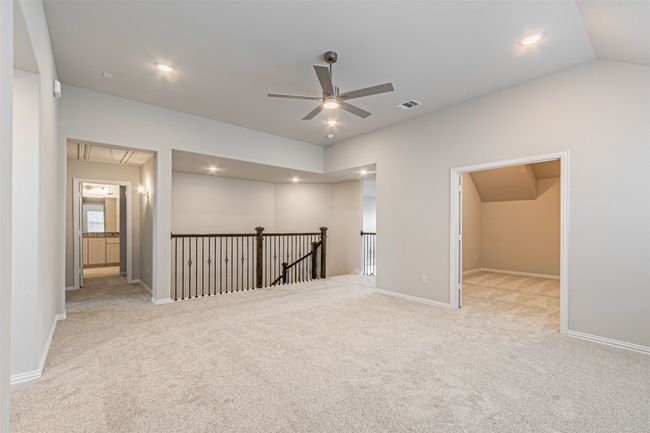 Spare room featuring attic access, ceiling fan, carpet, and recessed lighting | Image 32