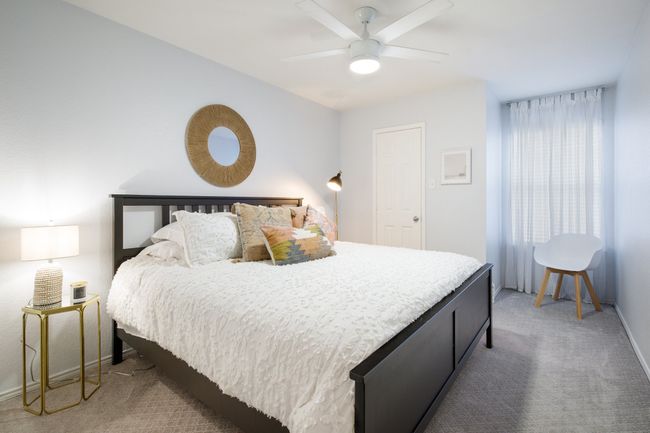 Bedroom with carpet flooring and a ceiling fan | Image 19